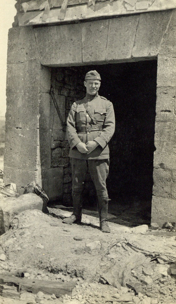 Howard R. Huston standing by old German kitchen