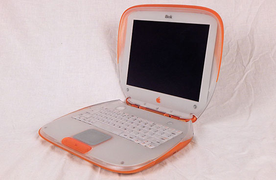 Apple iBook G3 laptop in orange and white