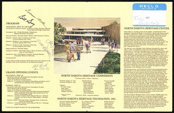 A light yellow, three panel brochure. The left side lists a program schedule and grand opening events. The middle has an image of the outside of a building with people walking up to it and also has text underneath it that lists the North Dakota Heritage Commission and North Dakota Heritage Foundation members. The right panel has a white and blue sticker that reads Hello my name is Terry Rockstad. Under the sticker is a bunch of text about the North Dakota Heritage Center.