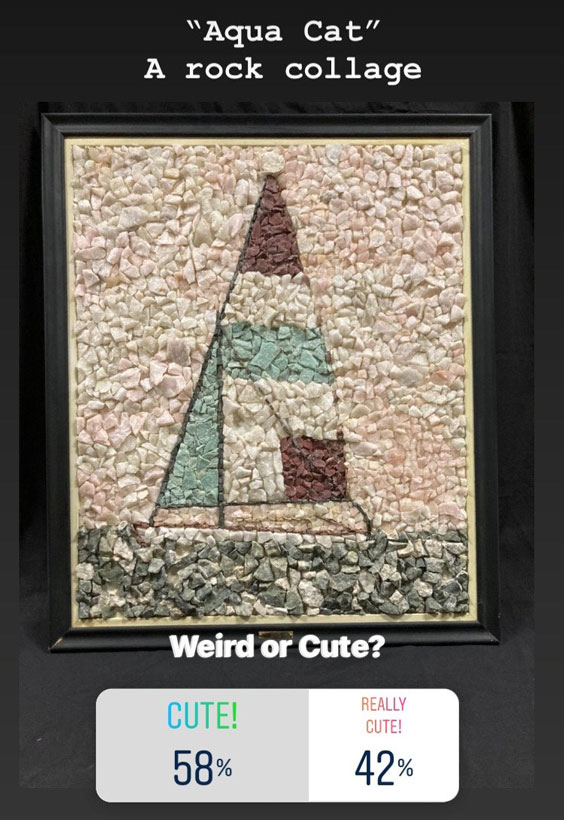 Aqua Cat - A rock collage. Weird or Cute? 58% Cute. 42% Really Cute. The image is of a shite, brown, and tan sailboat made out of rocks.