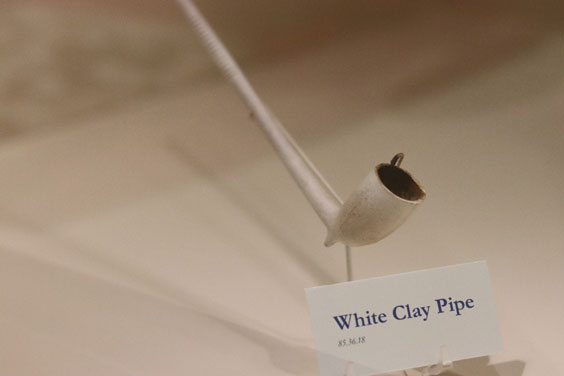 A white clay pipe with a label that reads the same