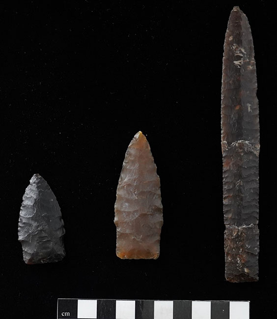 Three projectile points starting with the shortest on the left to the longest on the right