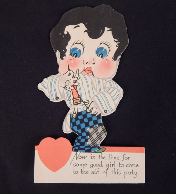 An old Valentine's Day card of a dark haired boy with big, blue eyes who's trying to sew a button onto his blue and black checkered pants for his red suspenders. The card reads Now is the time for some good girl to come to the aid of this party.