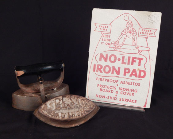 A metal iron and cover are shown next to a sign advertising the asbestos iron cover that reads No-Lift Iron Pad: Fireproof, asbestos, protects board and ironing cover, non-skid surface. Saves Time. Saves Energy. Just Slide it On.