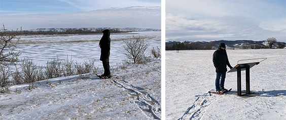 The image on the left shows a woman in black winter gear and snowshees standing next to a froxen river. the right image shows a man in black winter gear and showshoes standing next to an interpretive panel with hills in the background.
