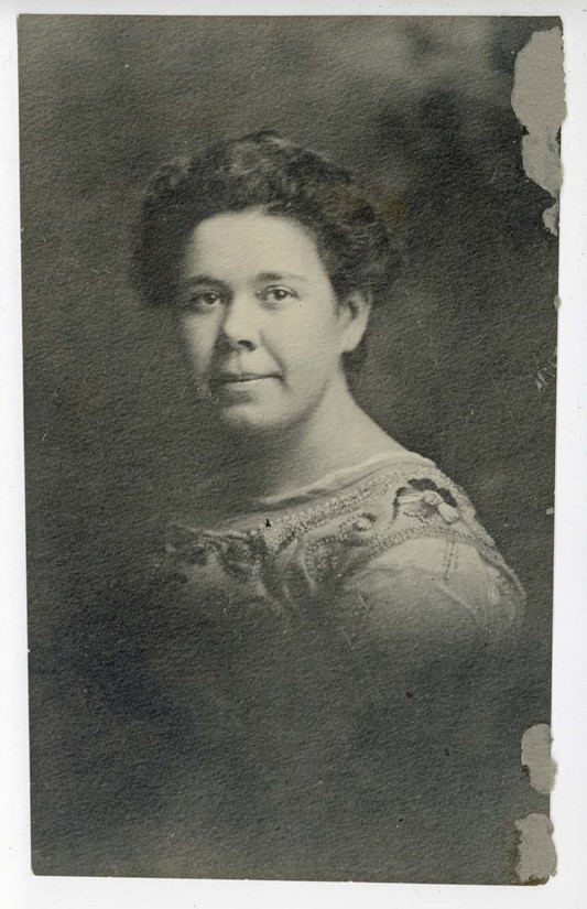Head and shoulders portrait of a woman with short, dark hair
