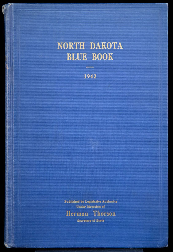 A blue book cover titled North Dakota Blue Book 1942