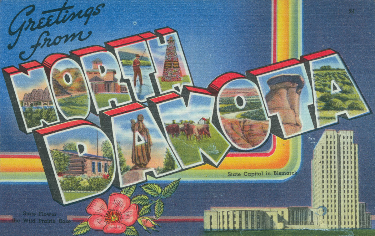 Blue postcard front with Greetings from North Dakota State Capitol in Bismarck State Flower the Wild Prairie Rose written on it. North Dakota is written in big, outlined text with images of different things you can see across the state in them, including a bridge, fisherman, log cabin, Sakakawea statue, river. The North Dakota State Capitol is in the lower right, and a wild prairie rose is on the bottom towards the center.