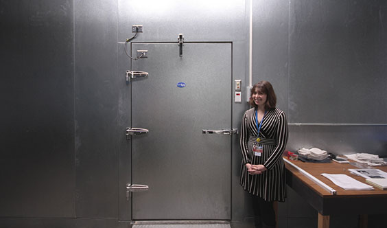 Sarah Walker bravely standing beide our cold storage unit