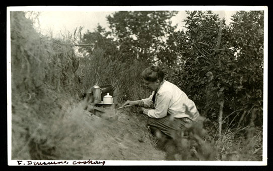 Frances Densmore cooking at a camp