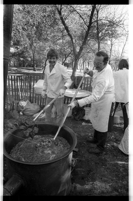 Men cooking pitchfork fondue during groundbreaking ceremony for the SHSND