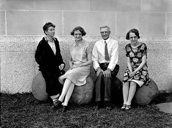 Group of 4 people dressed in 1920s clothing