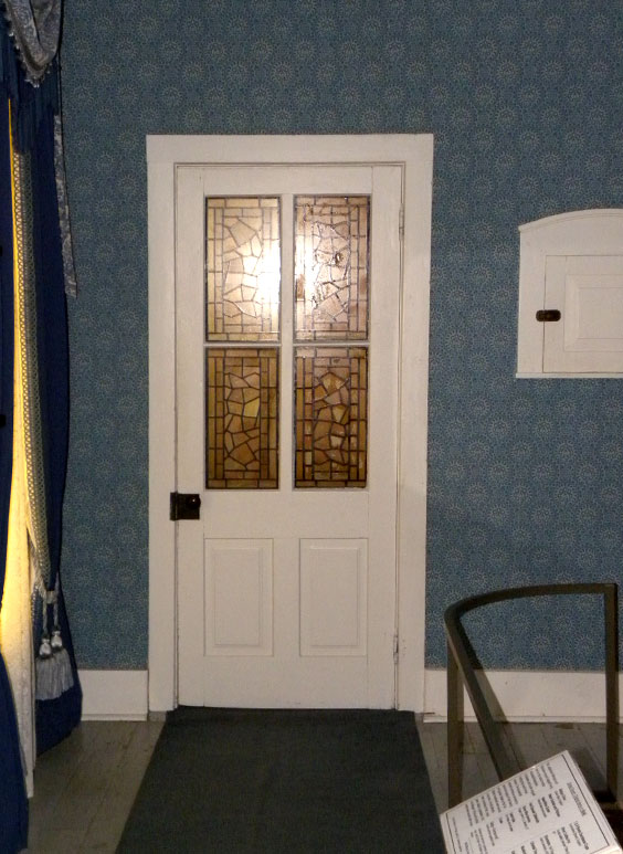 white door with yellow stained glass windows