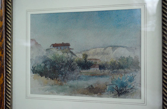 framed watercolor painting in blues, greens, browns
