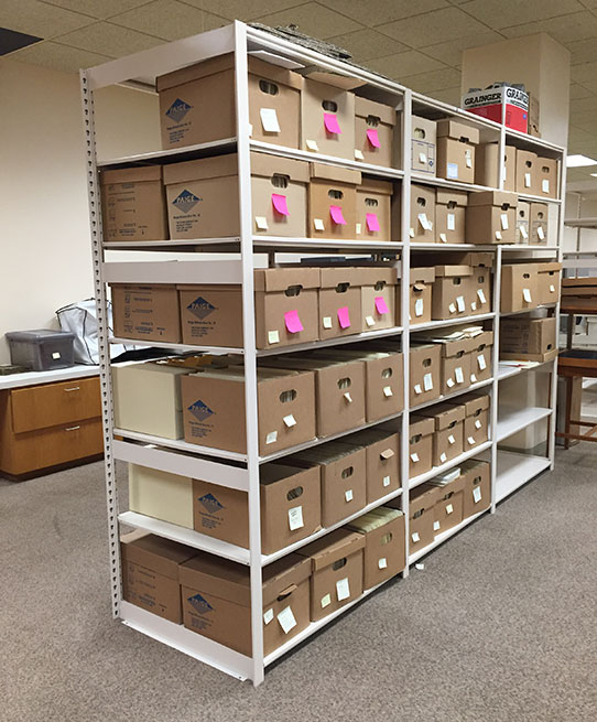 Shelves with boxes of Frank Vyzralek's collection