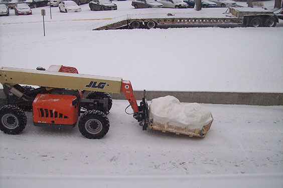 forlift moving dakota on a crate pallet in snowy landscape