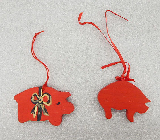 Two small Scandinavian pig ornaments