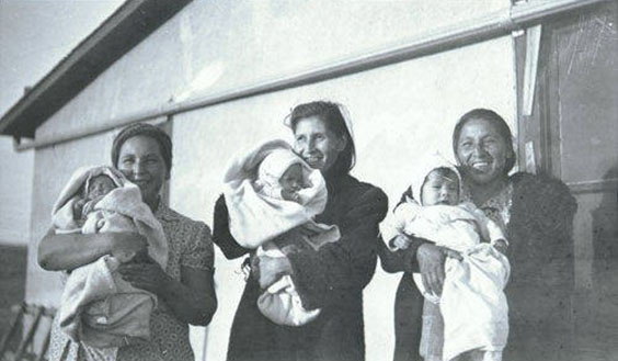 three women holding their babies