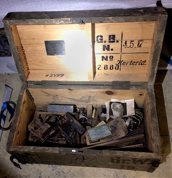 vintage trunk opened with artifacts inside