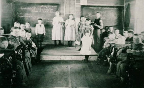 black and white photo of a classroom with students