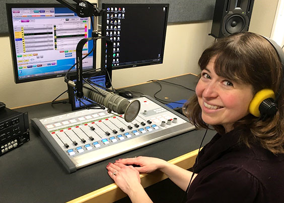 Sarah Walker at a computer and with radio equipment