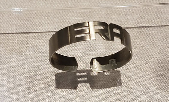 silver metal cuff bracelet with the letters E R A cut out