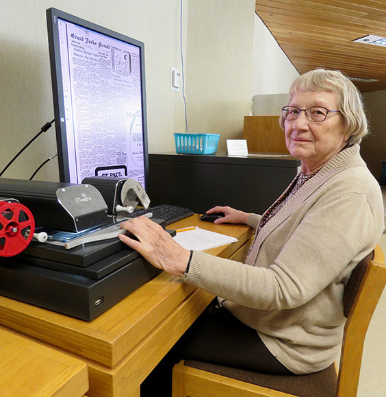 Volunteer working on computer in the State Archives