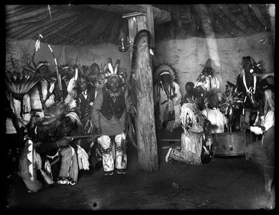 Photograph of Indians drumming and singing