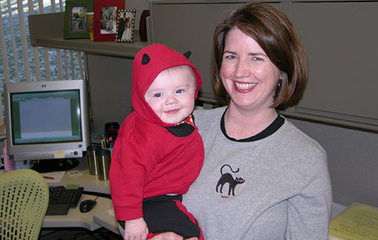 Employee holding her son