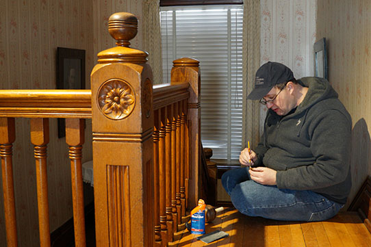 Johnathan Cempbell repairing banister