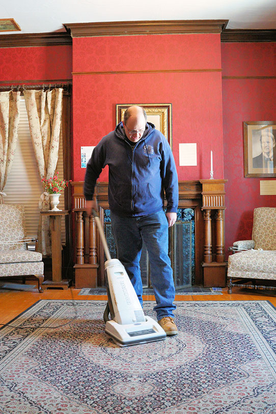 Johnathan Campbell vacuuming