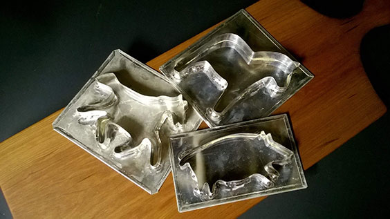 horse and pig tinware molds