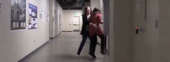 Sarah and Lindsay dancing in hallway