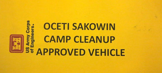 Plackard reading US Army Corps of Engineers. Oceti Sakowin Camp Cleanup Approved Vehicle