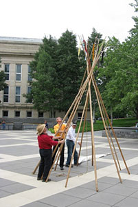 Setting up poles for a tipi