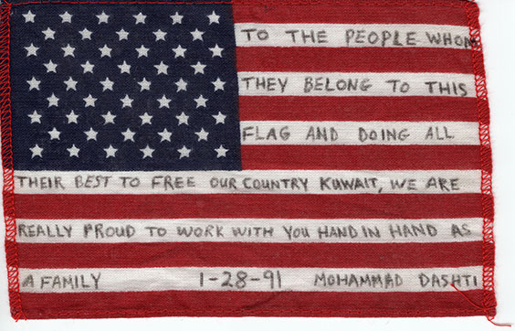 US flag with the following written on it - To the people whom they belong to this flag and doing all their best to free our country Kuwait, we are really proud to work with you hand in hand as a family. 1-28-91. Mohammad Dashti